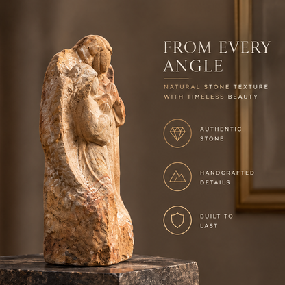 Side view of raw stone angel relief sculpture on dark marble base beside gold-framed artwork — From Every Angle, Natural Stone Texture with Timeless Beauty, Authentic Stone, Handcrafted Details, Built to Last