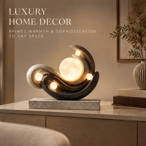 VITALUXO Moon Sculpture Stone Art Lamp glowing on sideboard console in warm living room with botanical vase, framed art and stacked books — Luxury Home Decor, Brings Warmth & Sophistication to Any Space