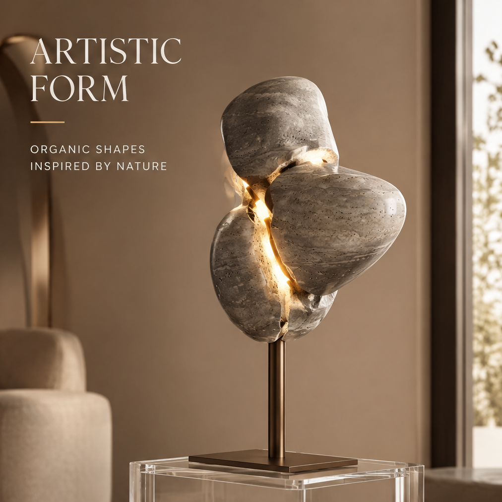 VITALUXO organic stone sculpture art lamp on acrylic plinth beside cream armchair and window with greenery — Artistic Form, Organic Shapes Inspired by Nature